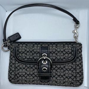 Wristlet purse by Coach. (Black)